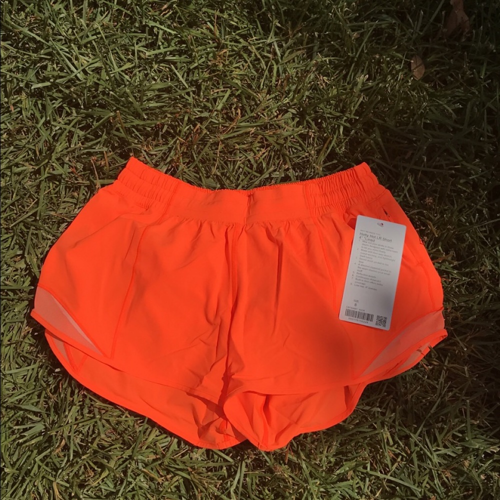 BRAND NEW neon orange lulu hotty hot shorts 4”